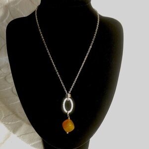 Abraxas silver toned necklace with gold coloured pendant, new without tags